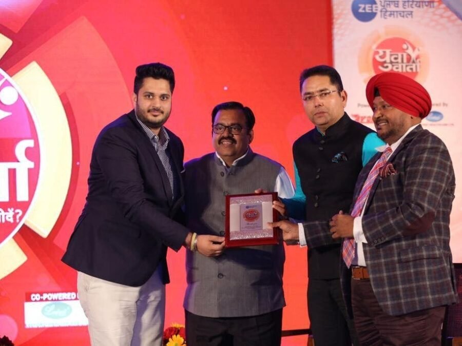 Regional Housing & Community Trophy being received by Divine Group